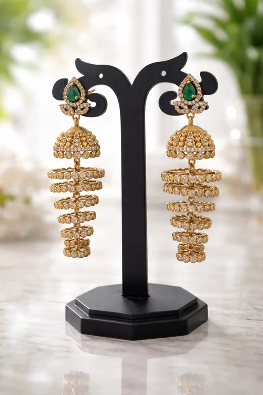 gold_plated_green_jhumka Gold Plated Green Stone Layered Jhumka Earrings - Image 1