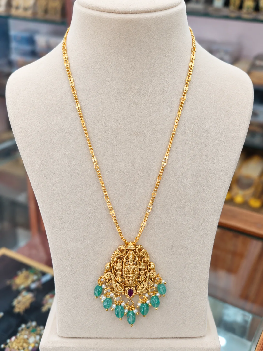 gold-plated-lakshmi-devi-pendant-green-beads-chain Gold Plated Balaji & Padmavathi Devi Pendant with Chain - Image 1