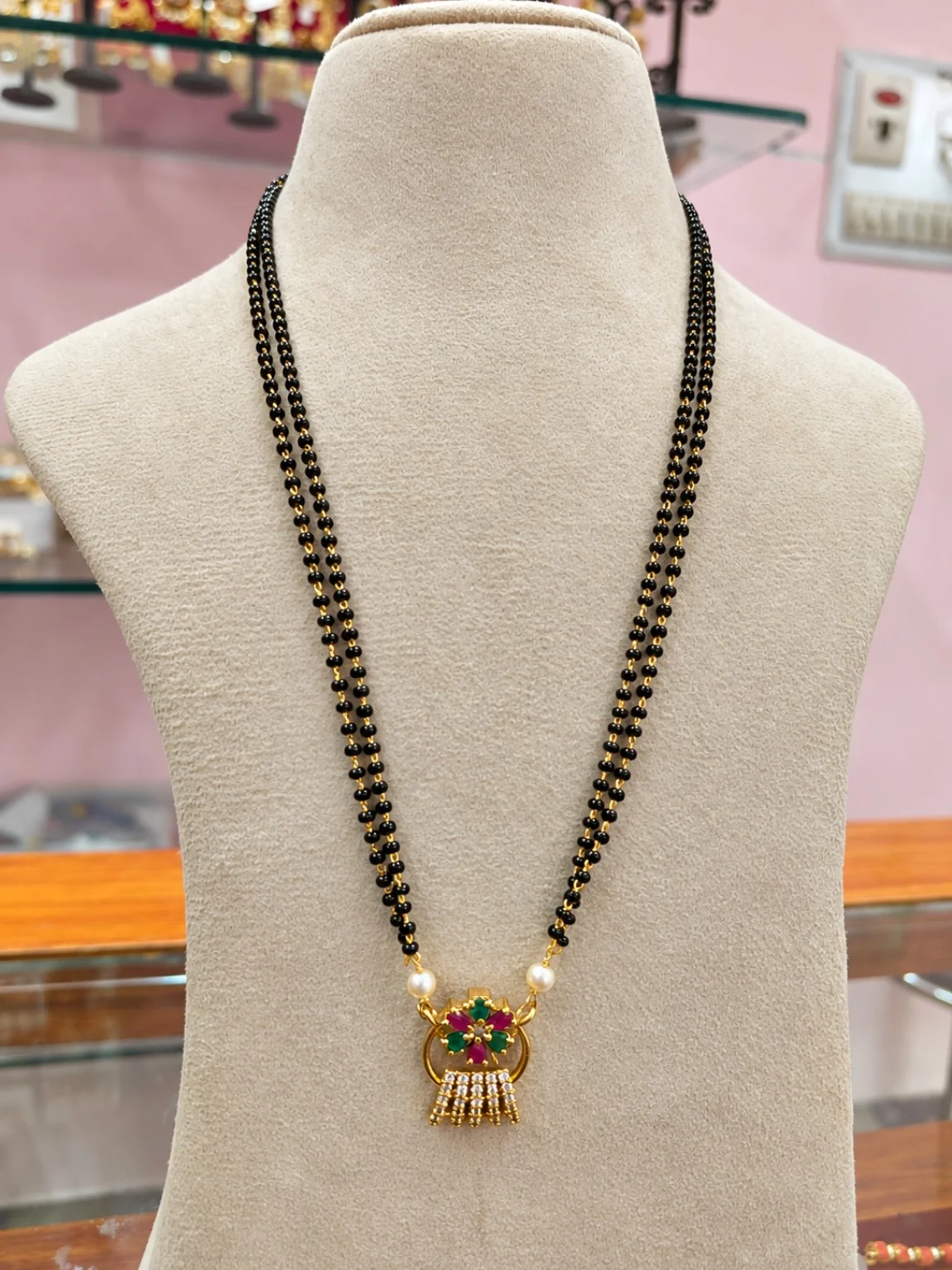 black-beads-double-string-floral-designer-pendant Black Beads Double-String Mangalsutra with Floral Designer Pendant - Image 1