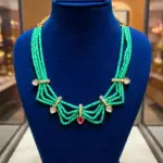 Elegant Green Multi-Strand Beaded Necklace with Gold-Tone CZ Accents and Pink Teardrop Pendant