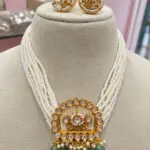 Premium Pearl Beads Kundan Necklace Set with Green Stone Drops & Matching Earrings