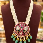 Traditional Multi-Strand Pearl Haram Necklace with Peacock Design Kundan Pendant