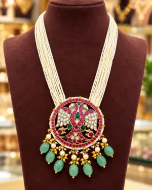 Traditional Multi-Strand Pearl Haram Necklace with Peacock Design Kundan Pendant