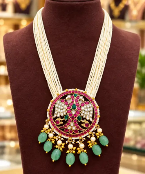 Traditional Multi-Strand Pearl Haram Necklace with Peacock Design Kundan Pendant